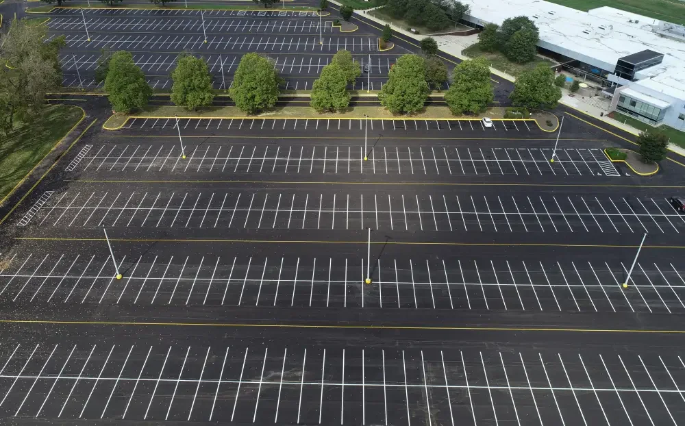 Commercial and industrial parking lot striping with ADA compliance and directional arrows